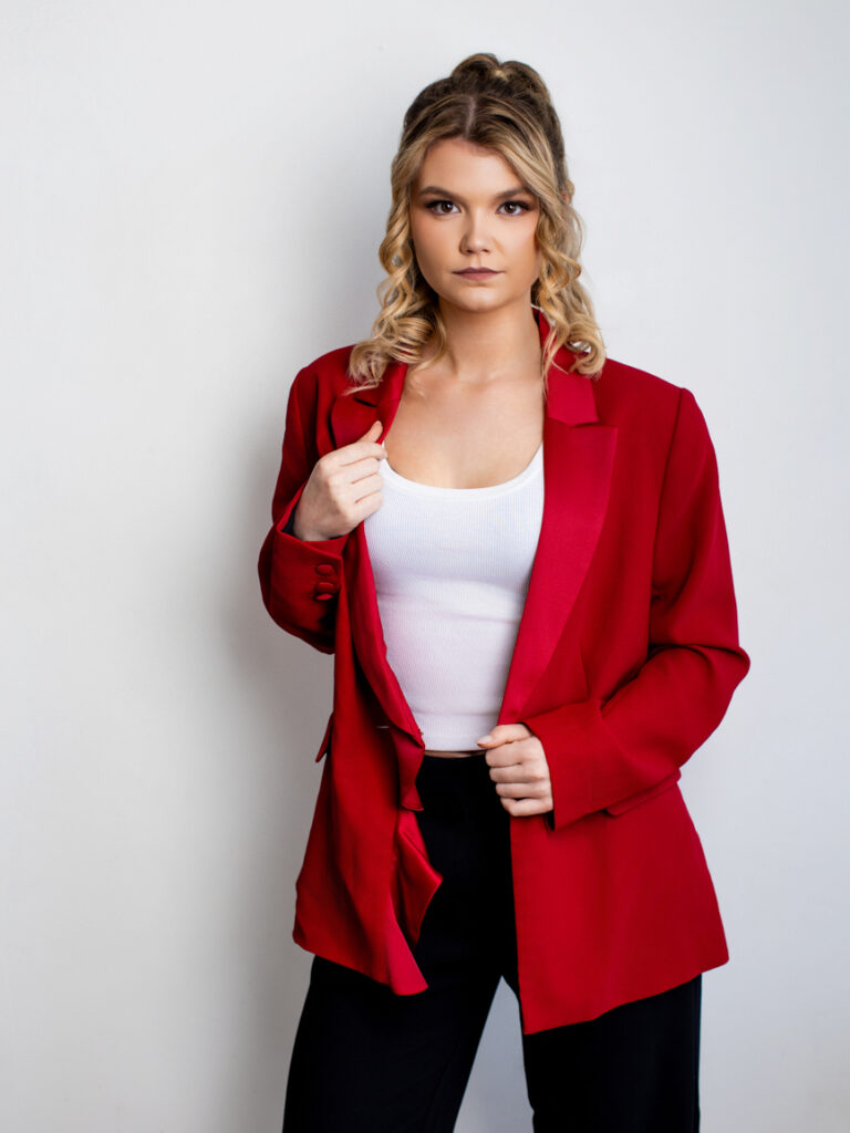 Empowered female founder posing for a high-impact corporate brand refresh.