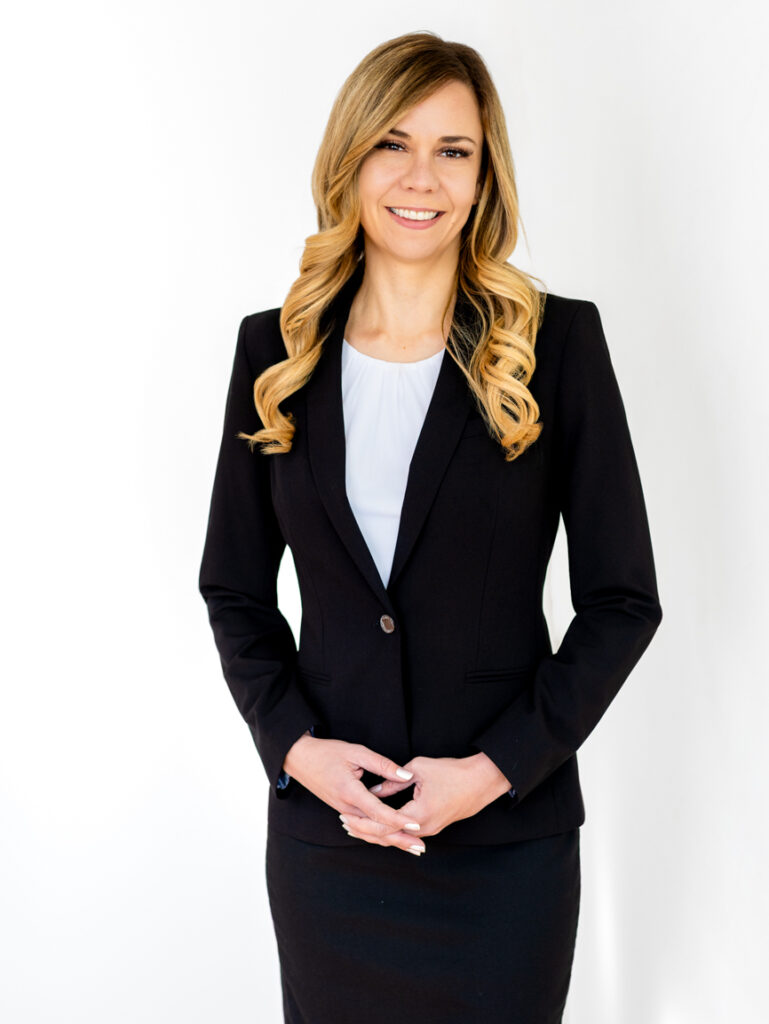 Woman executive using a tablet to demonstrate technology-led leadership.